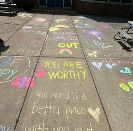 Positive chalk affirmations adorn NHP walkways. (Photo source: Ms. Vasek)